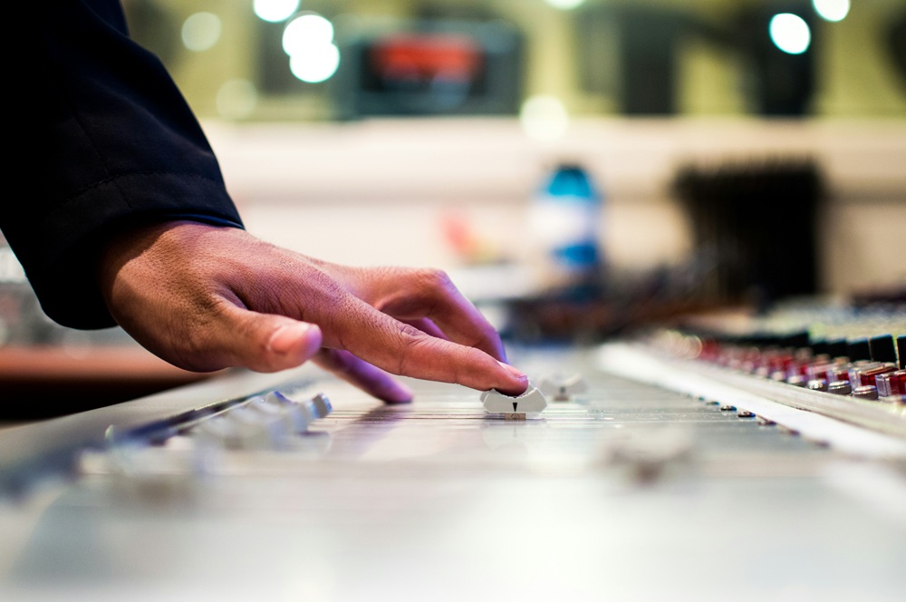 Source: https://unsplash.com/photos/person-holding-mixing-console-_o6AAx9dl_Y